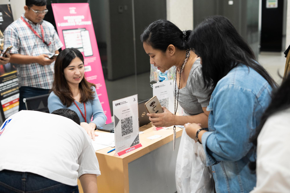 Face-to-face brand activation in Singapore with customers engaging at an event campaign